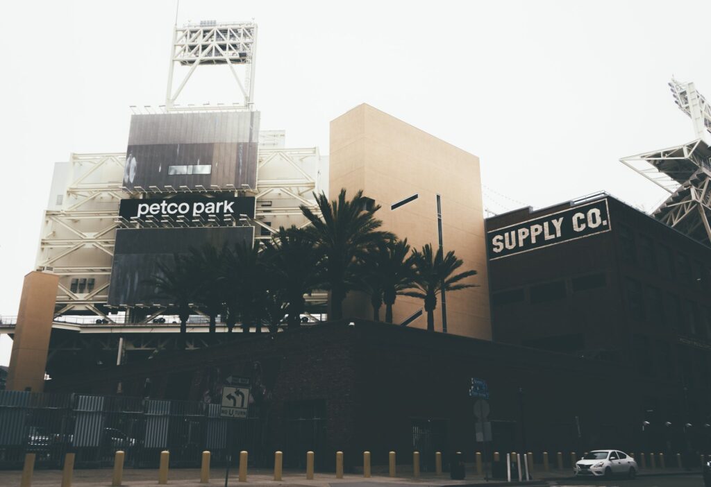 Cityscape featuring Petco Park, palm trees, and urban architecture in San Diego.