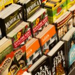 Colorful collection of travel brochures on display at a bookstore.