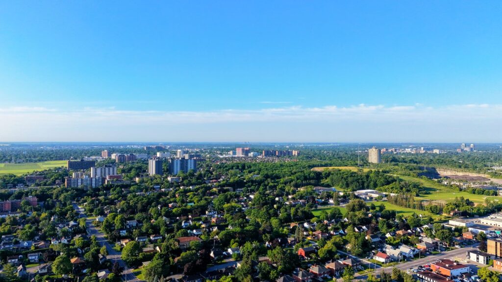 Aerial photograph showing a green urban residential area on a bright summer day.