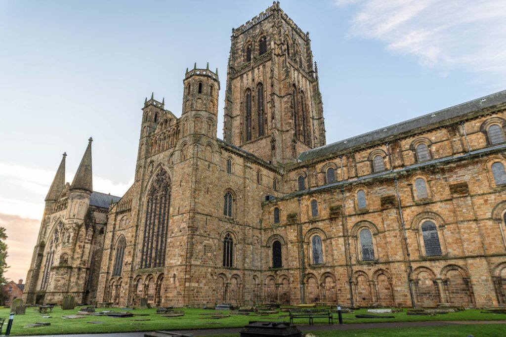 Durham Cathedral in England showcasing its impressive Gothic architecture at dusk.
