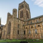 Durham Cathedral in England showcasing its impressive Gothic architecture at dusk.