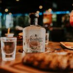 A sophisticated scene featuring Don Julio tequila with gourmet dining elements, ideal for lifestyle and beverage themes.