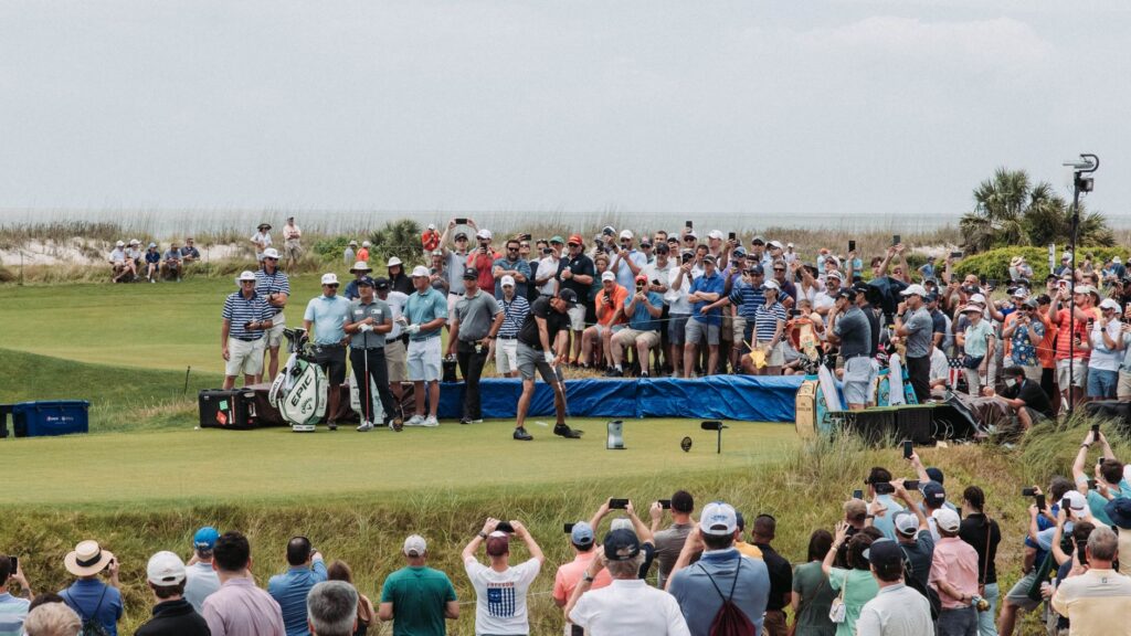 Golfers and fans gather for a thrilling tournament at Kiawah Island's lush course.