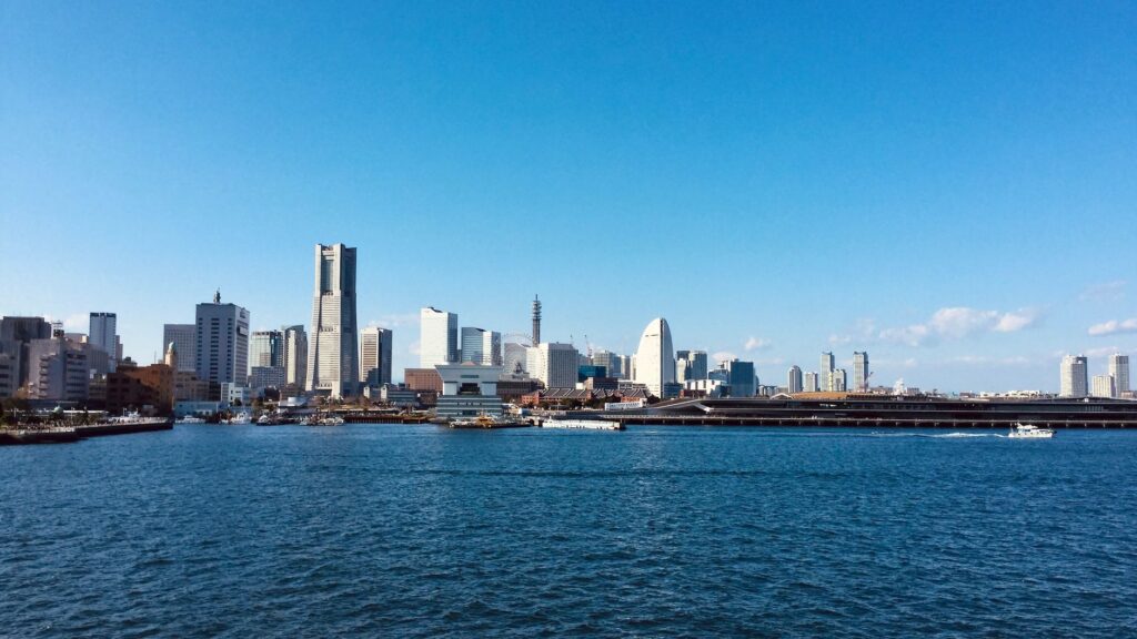 Explore Yokohama's stunning skyline featuring Landmark Tower under a clear blue sky.