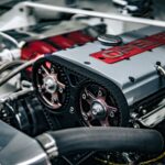 Detailed image showing the inner workings of an Opel car engine with components in focus.