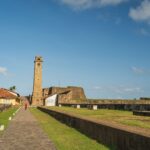 A stunning view of Galle Fort in Sri Lanka, featuring historic architecture and vibrant summer skies.