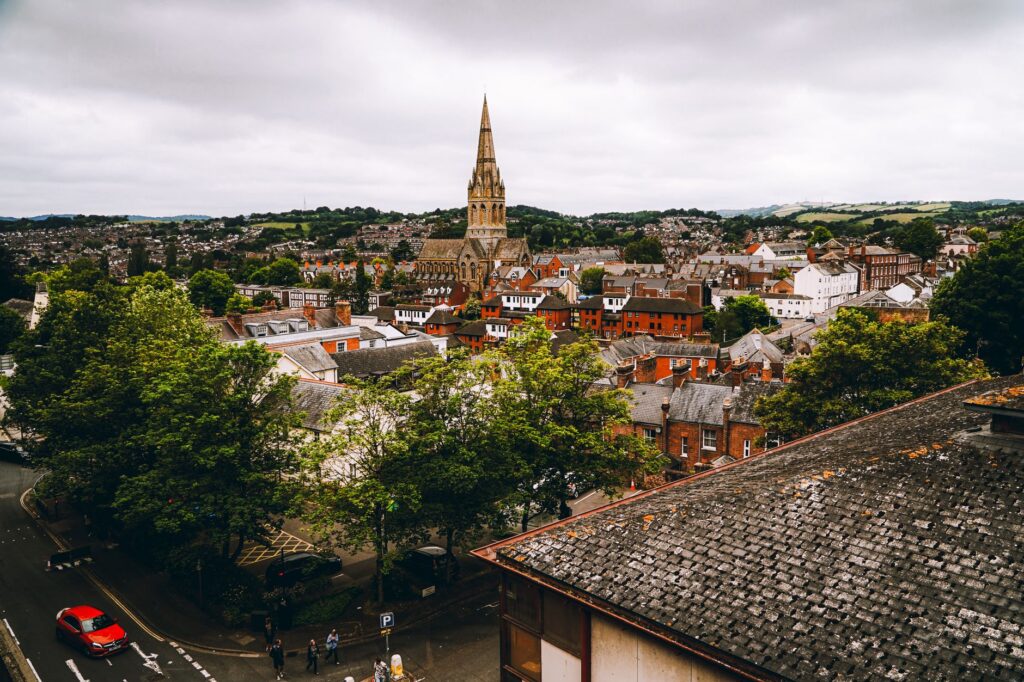 Aerial view of Exeter, England showcasing historic architecture and scenic urban landscape.