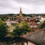 Aerial view of Exeter, England showcasing historic architecture and scenic urban landscape.