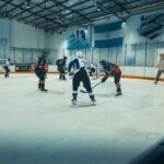 Competitive ice hockey game at Fantasy Skate Club in Buenos Aires, showcasing intense sports action on the rink.