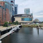 A picturesque view of TD Garden and the surrounding Boston harbor area with modern architecture.