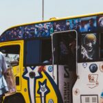 A vibrant matatu bus adorned with football artwork in Nairobi, Kenya, showcasing local culture and sports enthusiasm.