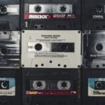 A nostalgic collection of vintage audio cassettes, showcasing iconic music from past decades.