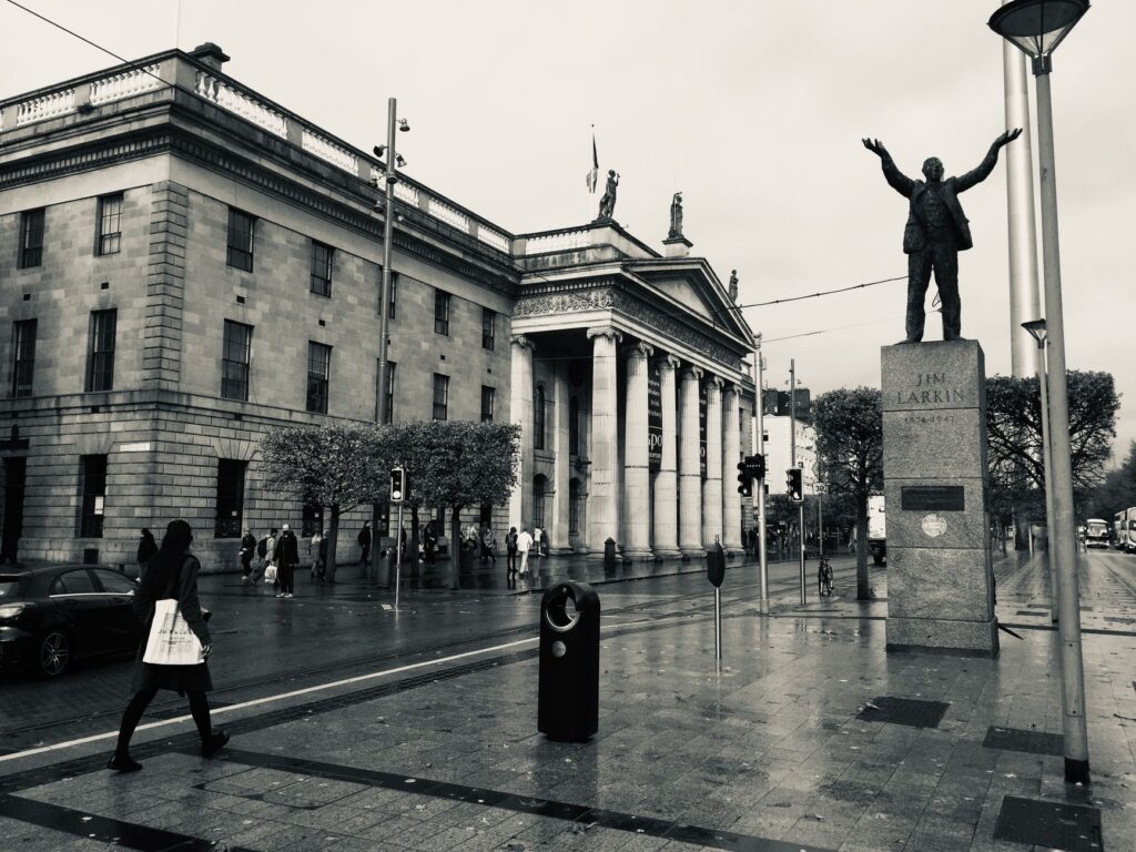 Black and white photo of the Jim Larkin Statue and General Post Office, Dublin.