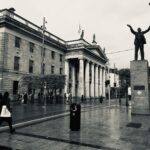 Black and white photo of the Jim Larkin Statue and General Post Office, Dublin.