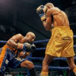 Two boxers face off in an intense match in Lagos, Nigeria. Skill and concentration on display.