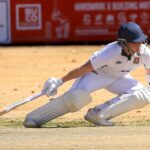 Dynamic shot of a cricketer playing during an intense outdoor match.