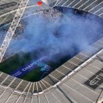 Aerial shot of Etihad Stadium during a soccer event in Manchester, UK.