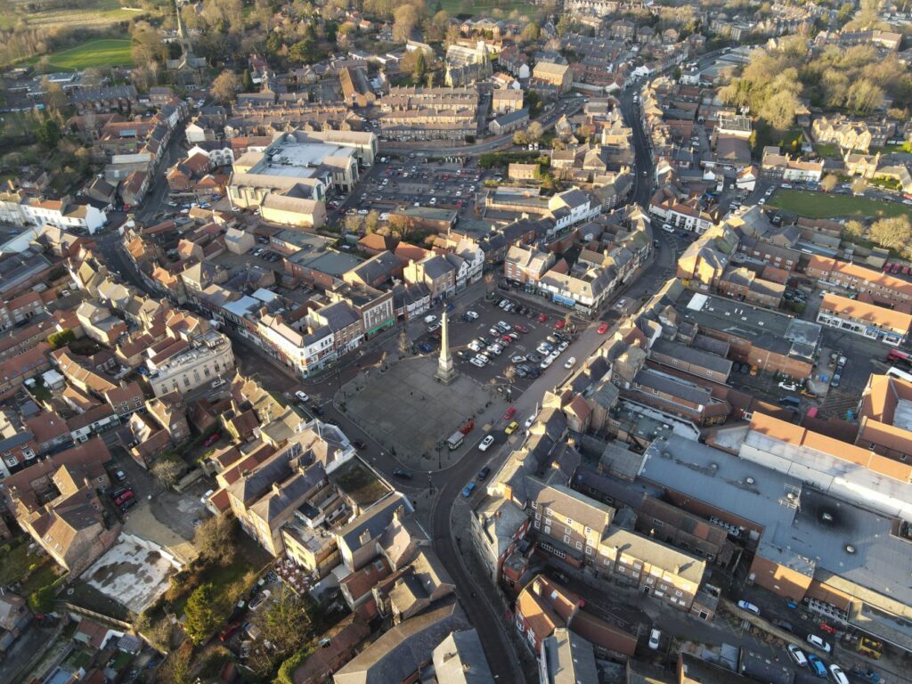 Drone shot of Ripon Market Square, showcasing the charming layout of the historic town in England.