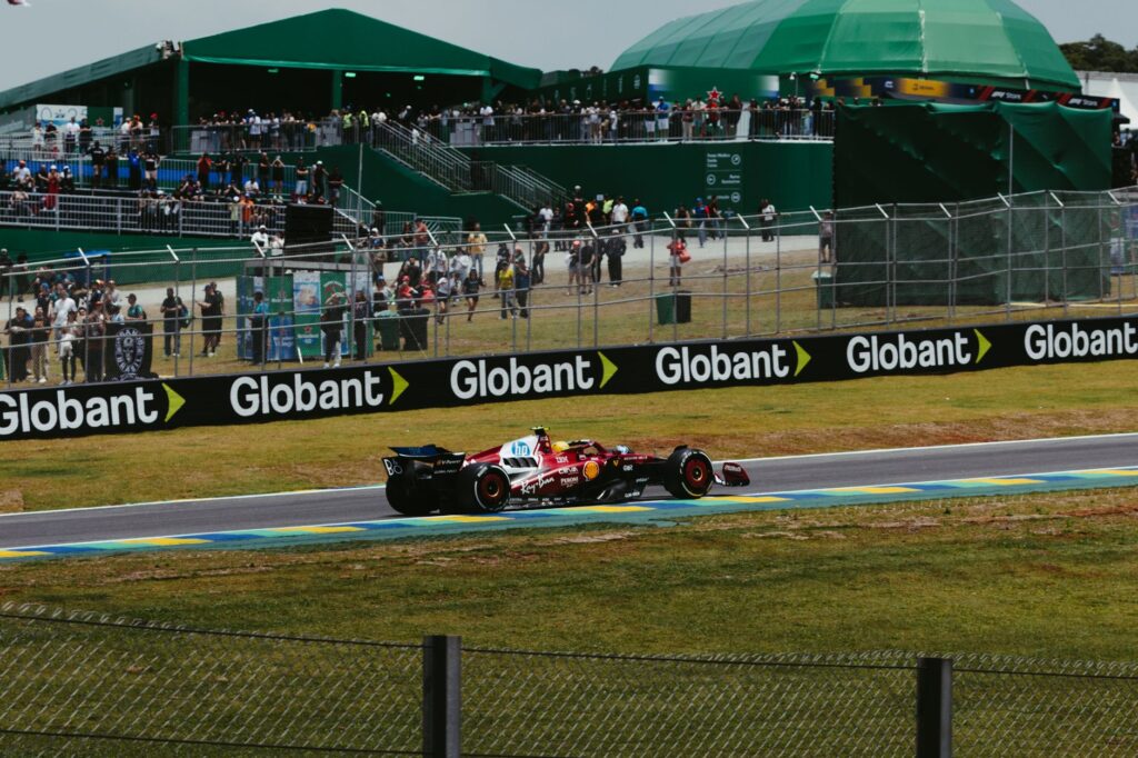 Exciting Formula 1 race action with Ferrari car at Interlagos, São Paulo, Brazil.