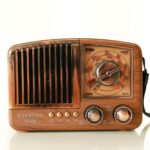 Close-up of a vintage wooden radio with a retro look, showcasing its classic design.