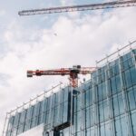 Architectural view of modern building under construction with crane, showcasing Dublin's urban development.