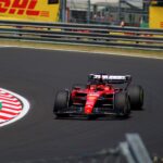 Ferrari F1 car racing at the Hungarian Grand Prix, showcasing thrilling motorsport action.