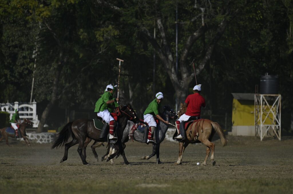 Action-packed scene of a traditional polo match in Imphal, showcasing vibrant uniforms and dynamic gameplay.
