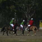 Action-packed scene of a traditional polo match in Imphal, showcasing vibrant uniforms and dynamic gameplay.