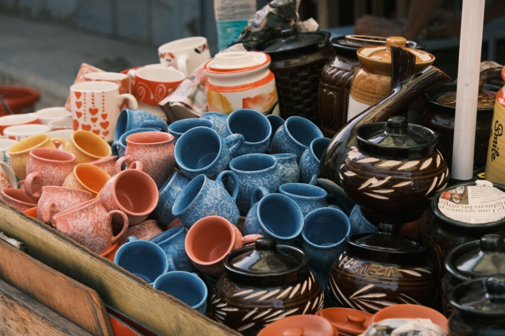 Vibrant display of ceramic cups and pots in Bengaluru market showcasing craftsmanship.
