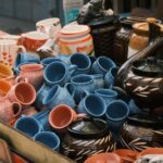 Vibrant display of ceramic cups and pots in Bengaluru market showcasing craftsmanship.