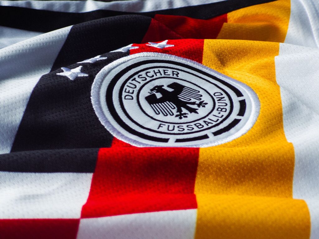 Detailed view of the German national football team jersey with emblem.