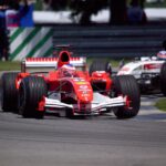 Thrilling Ferrari and Honda Formula 1 race at Indianapolis, showcasing motorsport excitement.