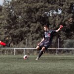 Dynamic soccer match action featuring players in France, showcasing athleticism and competition.
