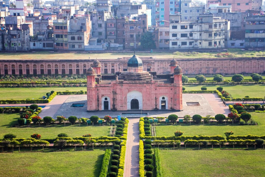 Aerial shot of the historic Lalbagh Fort in Dhaka surrounded by gardens and cityscape.