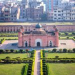 Aerial shot of the historic Lalbagh Fort in Dhaka surrounded by gardens and cityscape.