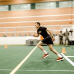 Captivating shot of an army soldier sprinting during fitness test indoors.
