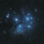 Captivating image of the Pleiades star cluster against a starry night sky.