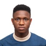 Close-up portrait of a serious young man with neutral expression on white background.