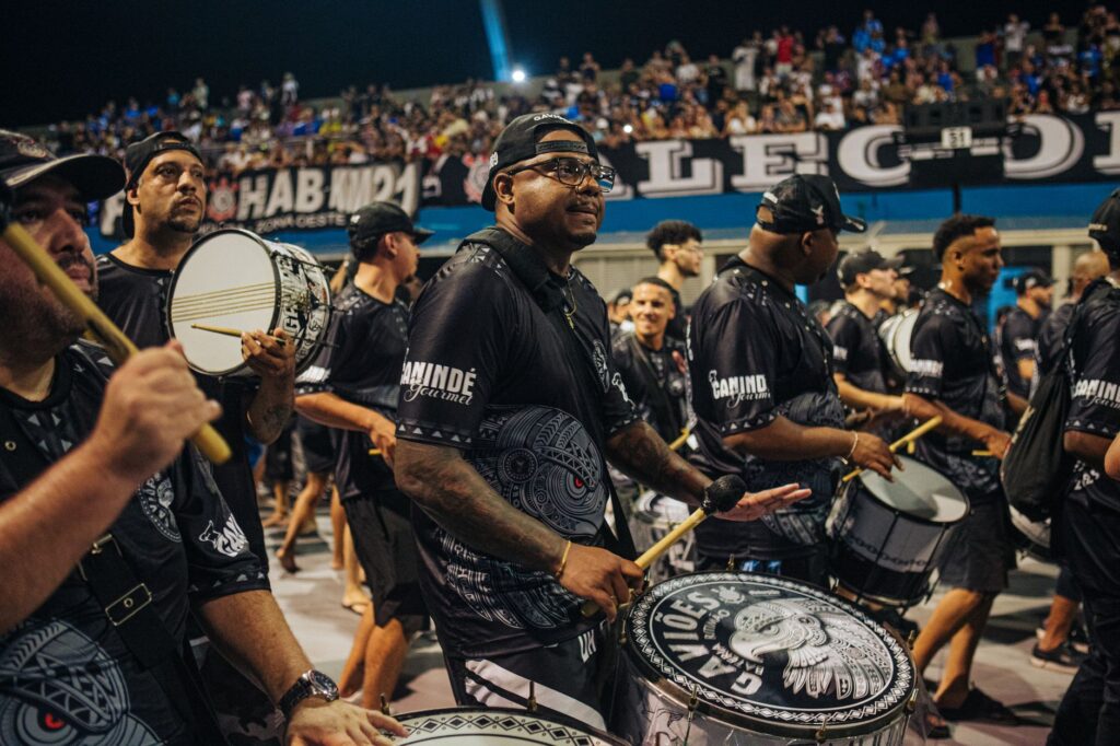 Exciting drum band performance during a vibrant carnival in São Paulo, Brazil, capturing cultural celebration.