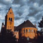 Barnes Hall in Ithaca, NY with its distinct architecture against a moody cloudy sky.