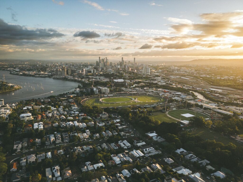 Stunning aerial view of Brisbane, Queensland at sunset with city skyline and river.