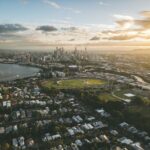Stunning aerial view of Brisbane, Queensland at sunset with city skyline and river.