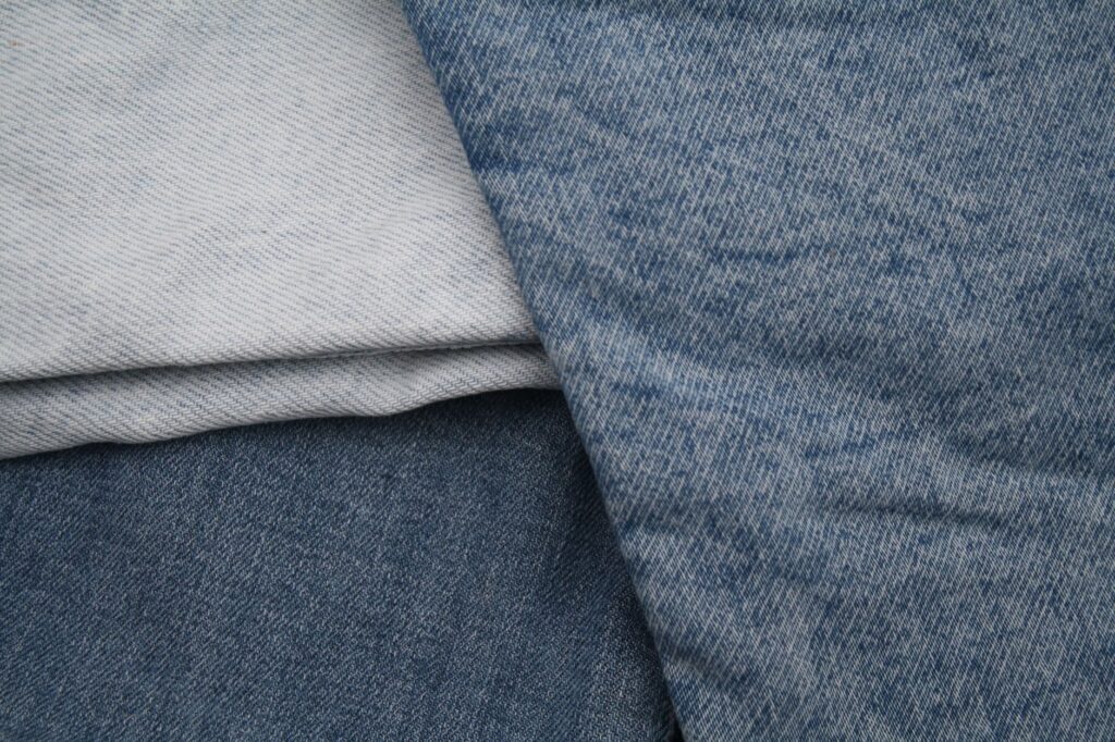 Detail view of blue denim fabrics showcasing textures and weave patterns.