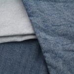 Detail view of blue denim fabrics showcasing textures and weave patterns.