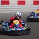 Dynamic go-kart racing action with two drivers speeding at Yas Marina Circuit, Abu Dhabi.