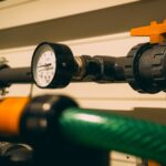 Close-up view of an industrial pressure gauge attached to piping. Ideal for engineering or industry visuals.