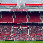View of the Stretford End crowd at Manchester's iconic stadium during a day event.
