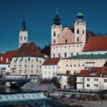 Scenic view of St. Michael's Church and river in Steyr, Austria.