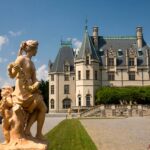 Stunning view of Biltmore Estate's chateauesque architecture and classical sculptures.