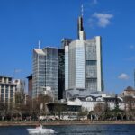 Frankfurt skyline with modern skyscrapers along the Main River, featuring iconic architecture.